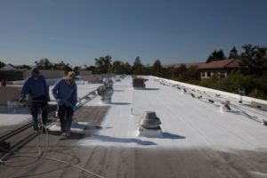 Old roof was cleaned before prep work and first coat of Acrylic was applied.