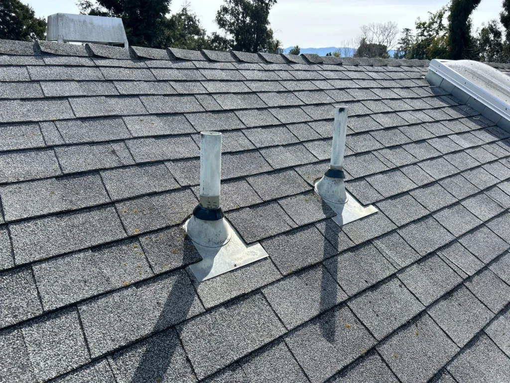 Composition shingle roof with new pipe jack collars after pre-sale roof repairs completed in San Jose, CA