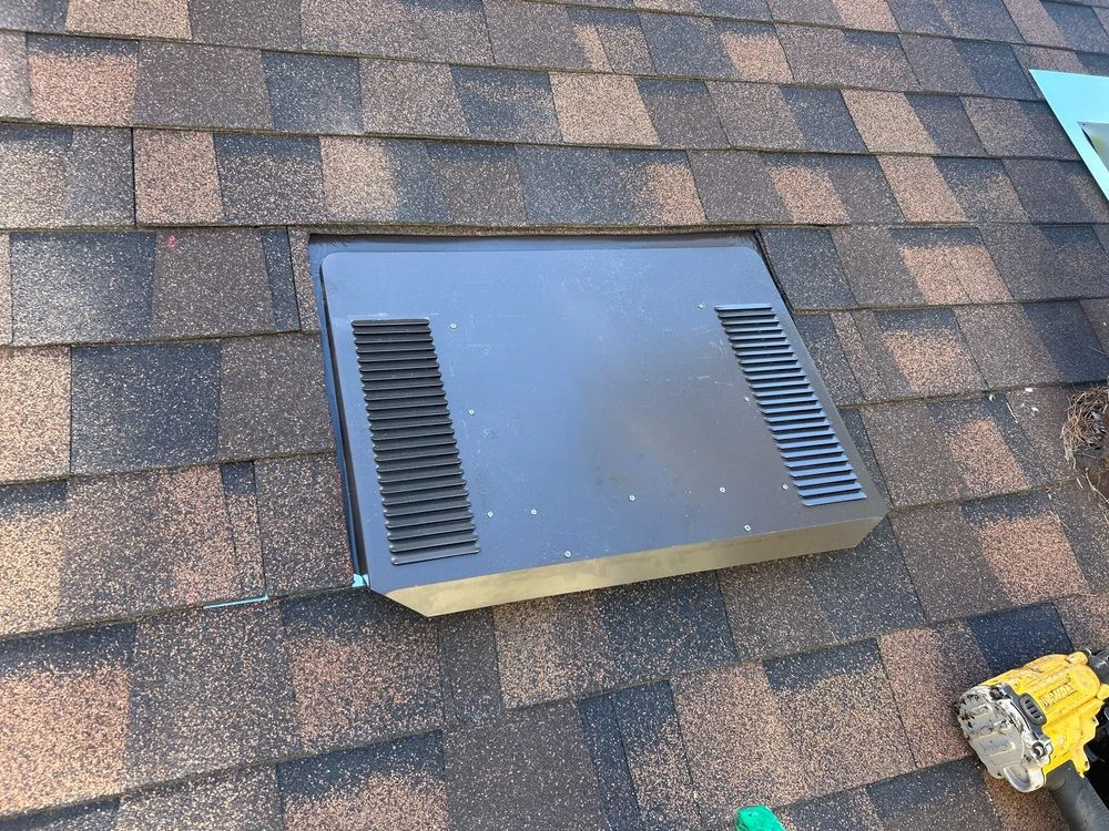 O’Hagin intake vent installed on a shingle roof to improve attic ventilation in Palo Alto, CA.